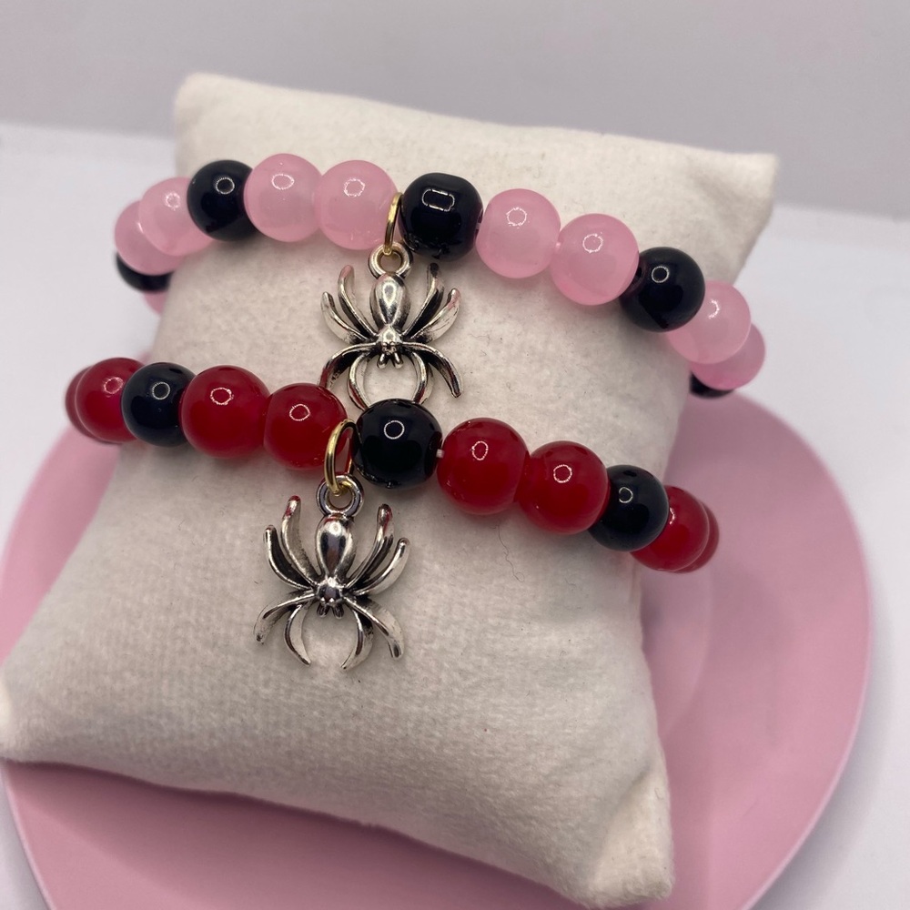 Matching spiderman x Gwen Stacy bracelets with connecting heart magnet